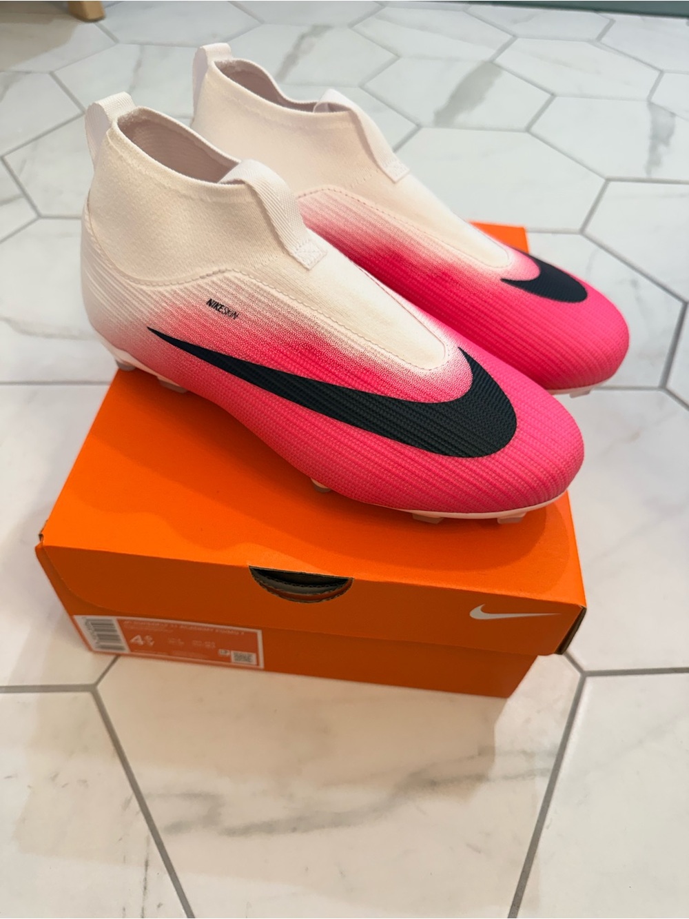 Nike Kids Laceless Soccer Cleats in White and Pink with Black Swoosh